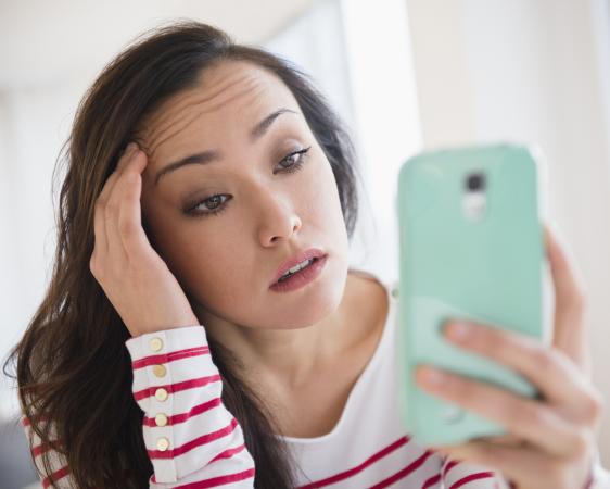 217989-562x450-stressedwithphone